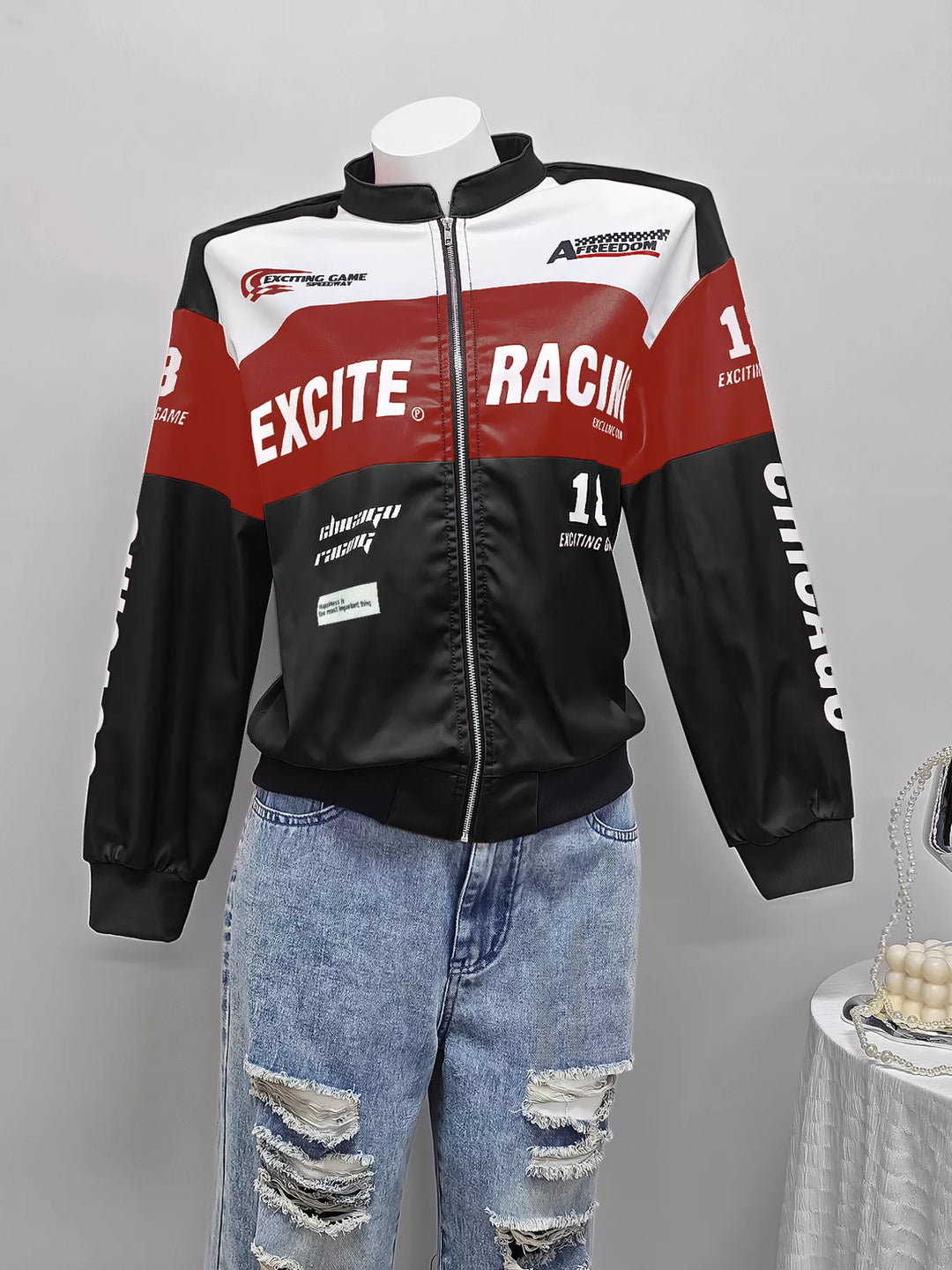 Racing letter print cropped bomber in black, flat lay