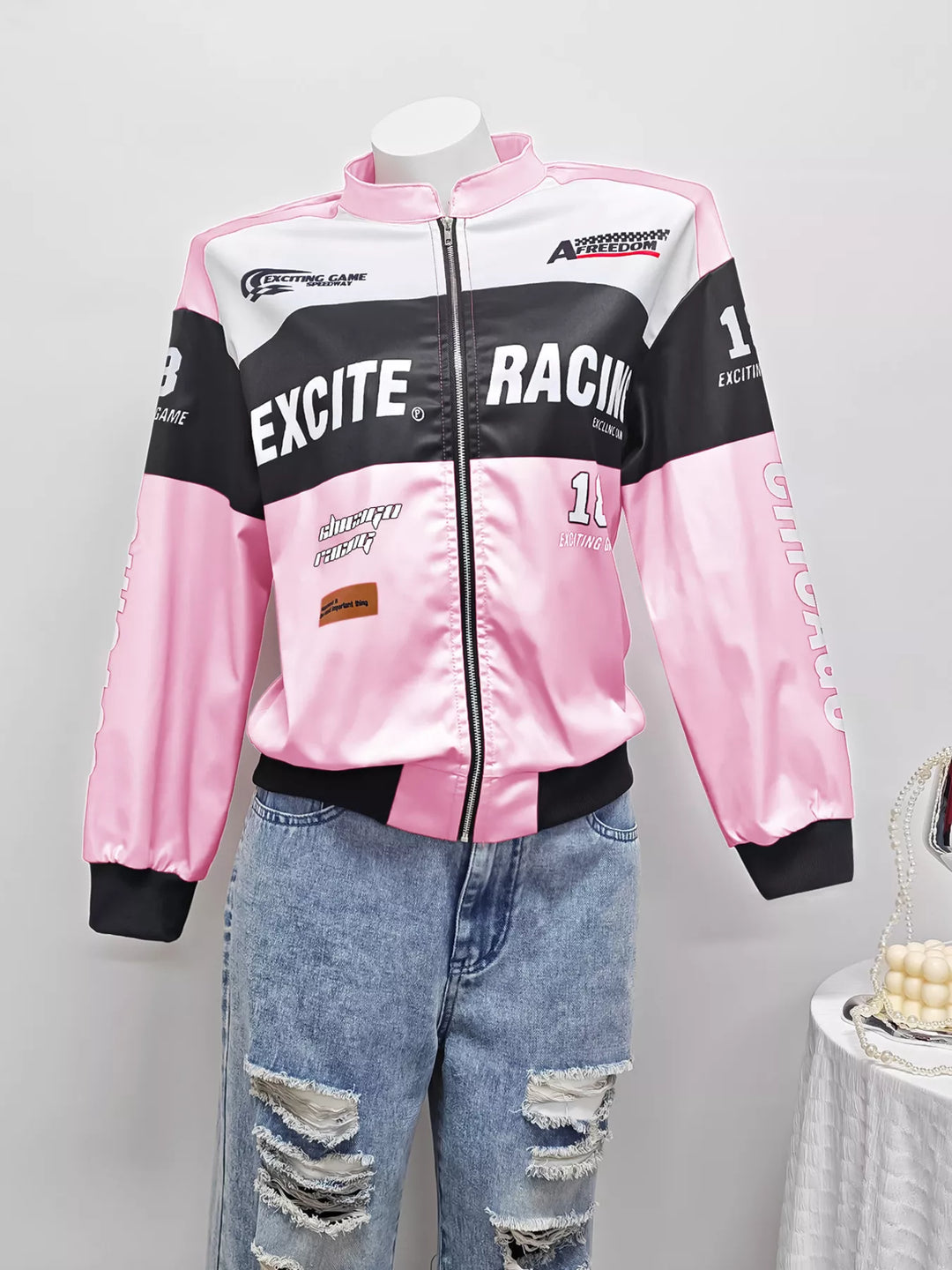 Racing letter print cropped bomber in pink, flat lay