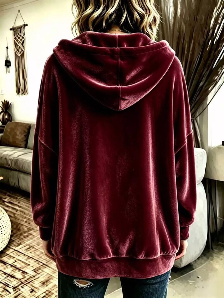 Back view of the burgundy hooded jacket with relaxed fit