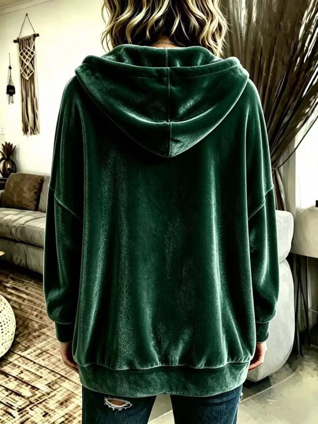 Back view of the forest green hooded jacket with ribbed cuffs