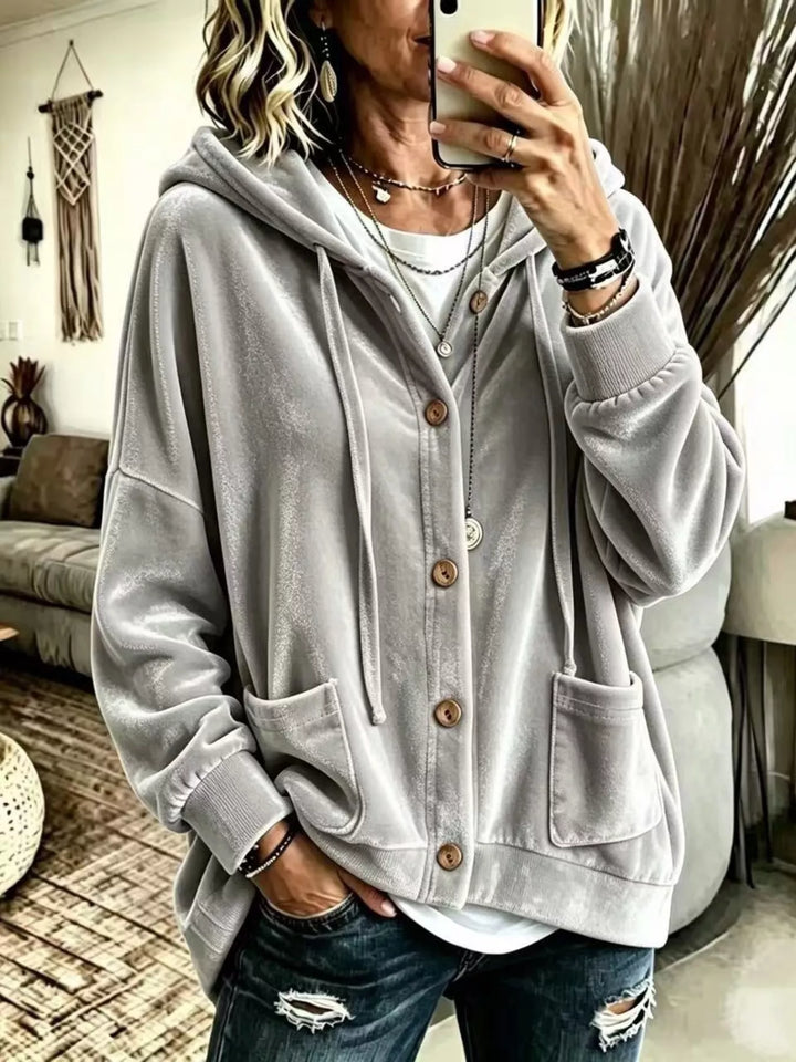Light gray hooded button front jacket with patch pockets and drawstring hood