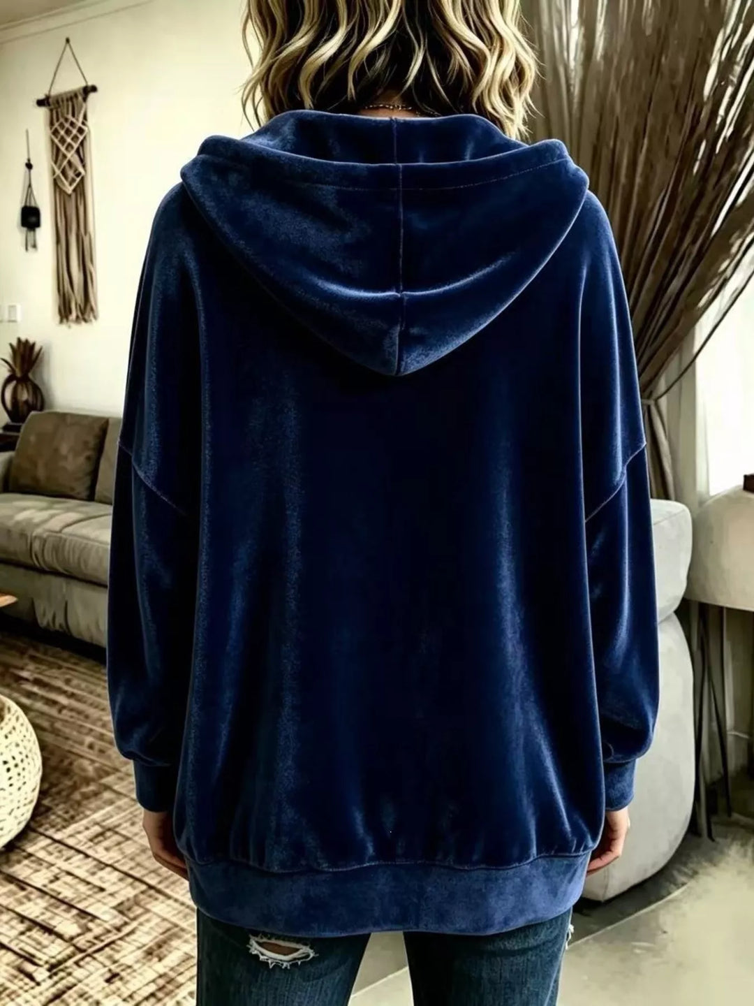 Back view of the navy velvet-look hooded jacket with ribbed hem
