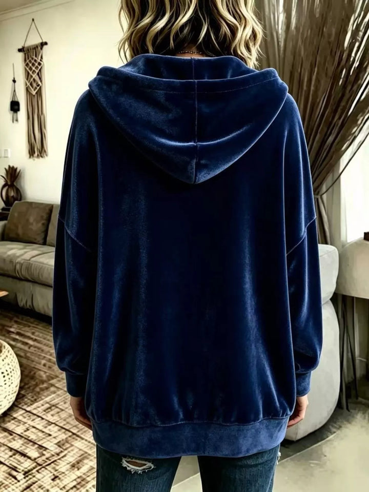 Back view of the navy velvet-look hooded jacket with ribbed hem
