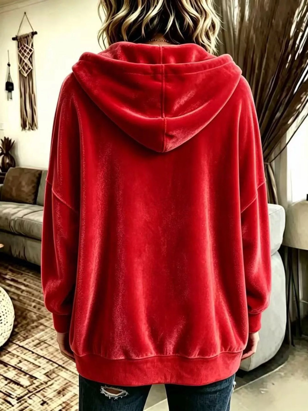 Back view of the red relaxed hooded jacket with ribbed hem