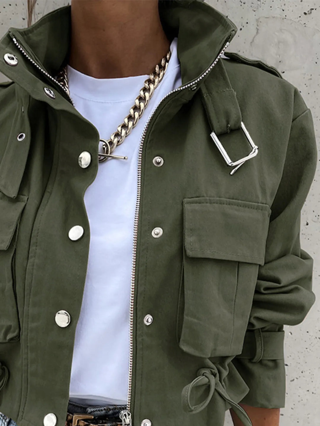 Snap front cropped flap pockets in army green, close-up detail