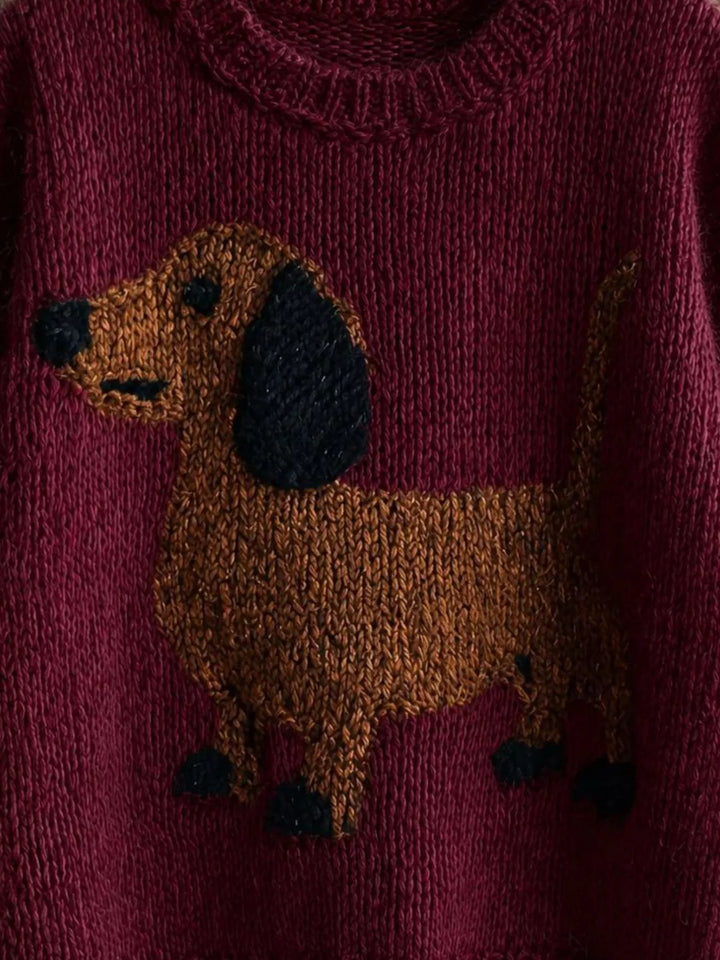 Close-up of the dachshund pattern on the burgundy knit sweater