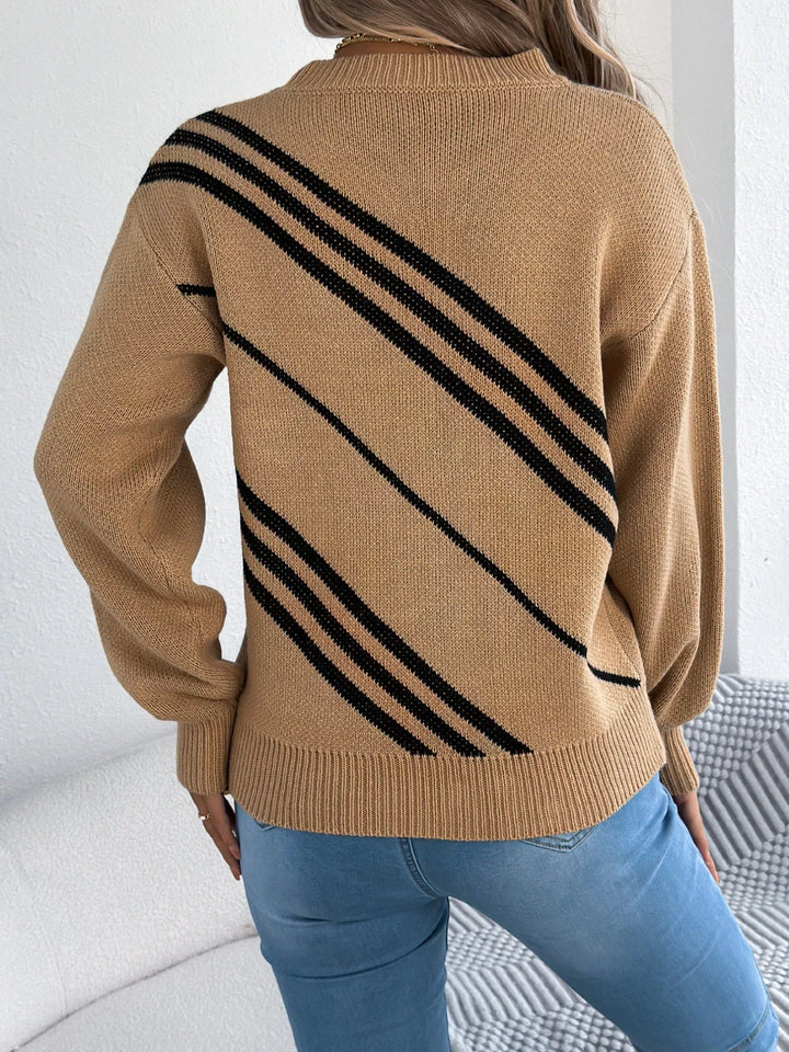 Back view of the camel crew neck sweater with bold black diagonal stripes