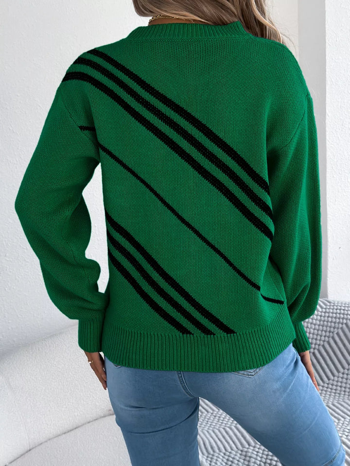 Back view of the emerald green sweater with diagonal black stripes