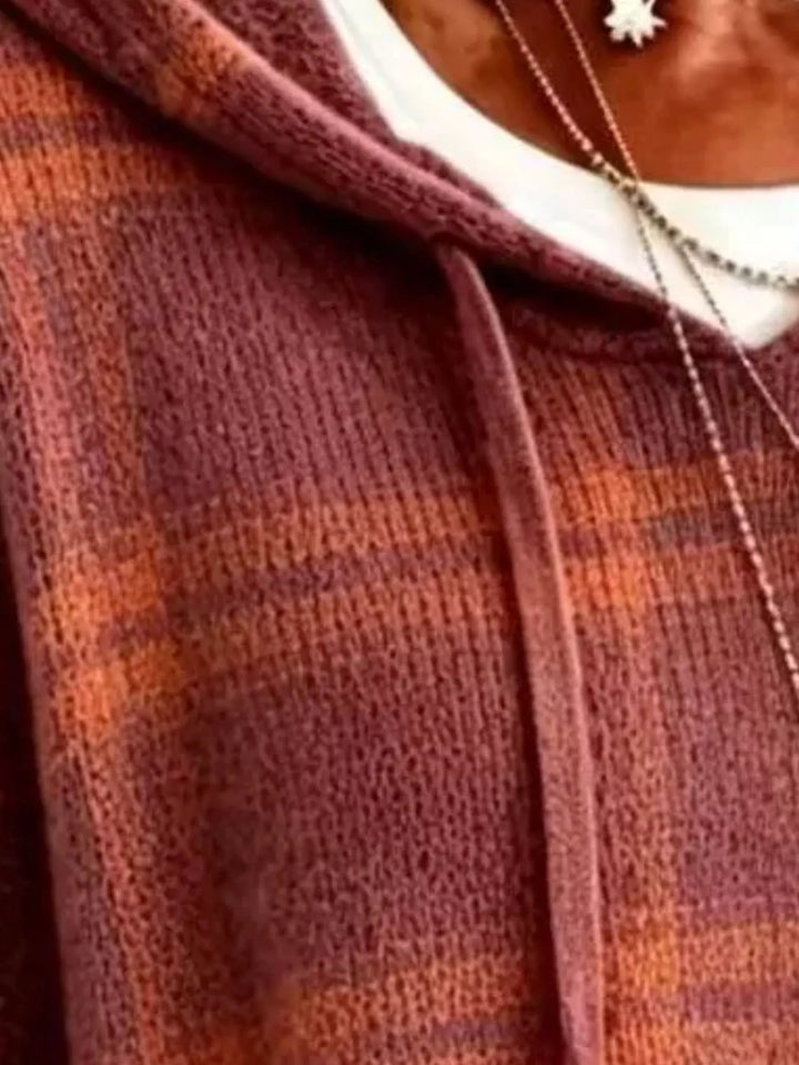 Close-up of the brick red plaid knit with hood drawstrings