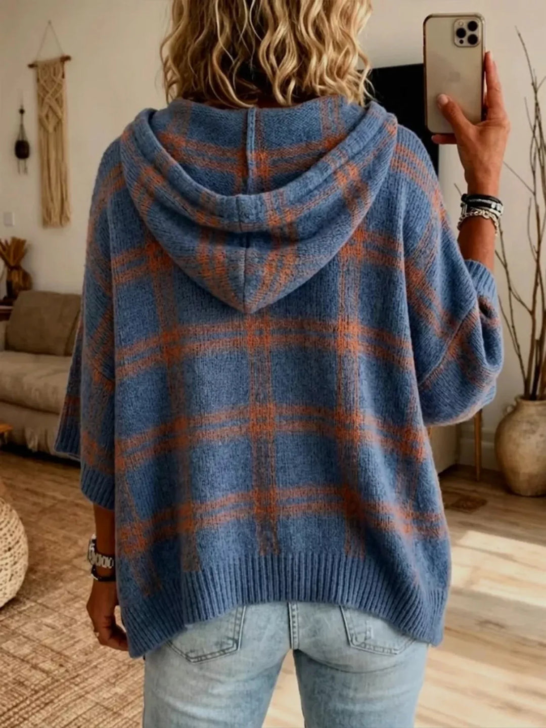 Back view of the slate blue plaid hooded pullover with batwing sleeves