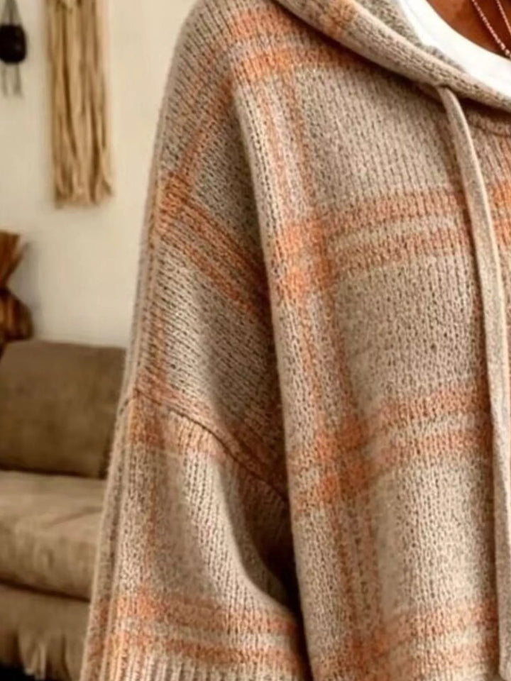 Close-up of the taupe plaid knit sleeve and hood drawstring