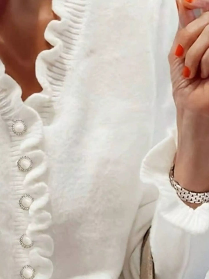 White sweater button placket with pearl look buttons and ruffle edge