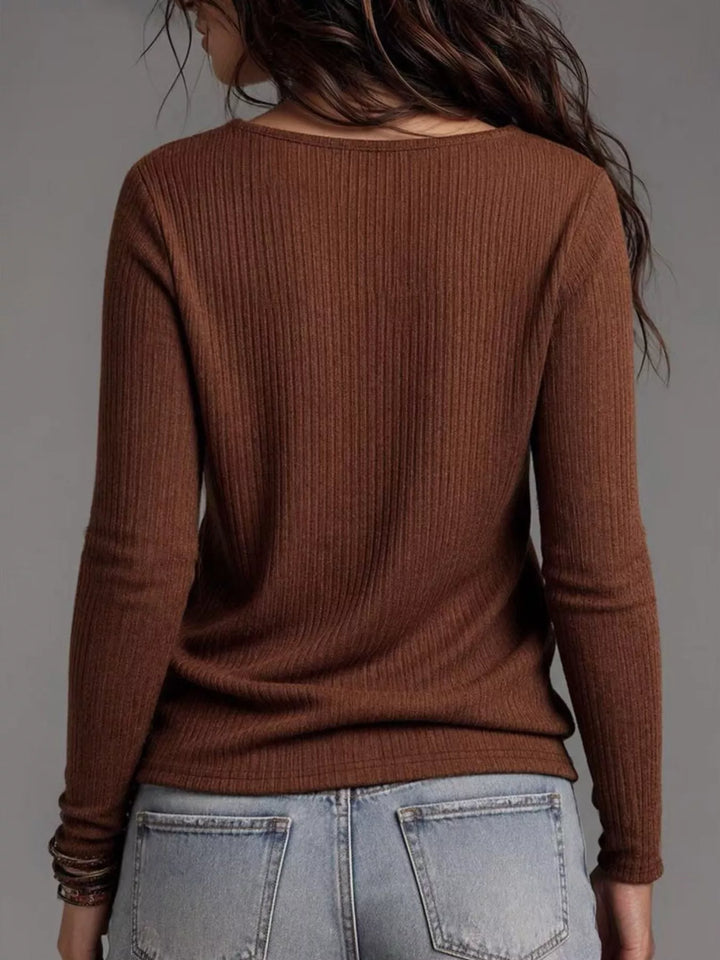 Back view of the dark brown ribbed long sleeve top with jeans