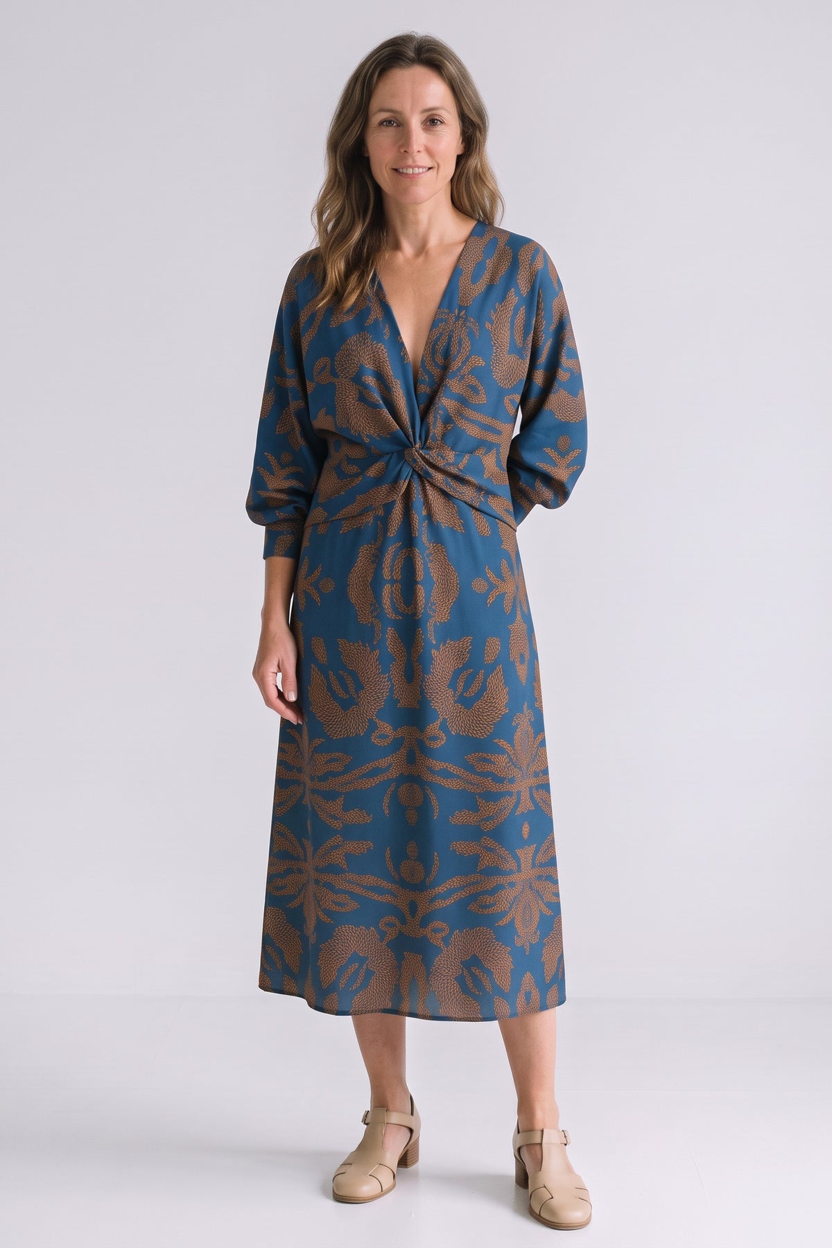 Women's Fall Wedding Guest Dress | Long Sleeve Twist Midi — Blue — front view — on model