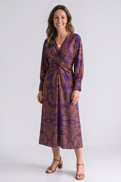 Women's Fall Wedding Guest Dress | Long Sleeve Twist Midi — Violet — front view — on model