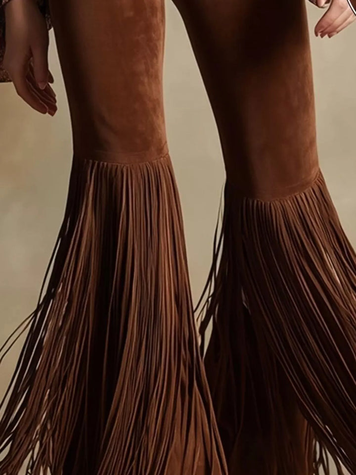 Close-up of the brown flare pants fringe hem and high waist fit
