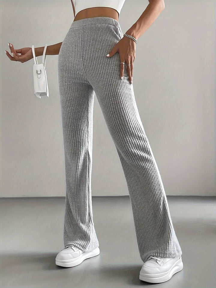 Heather gray ribbed flare pants front view with white sneakers
