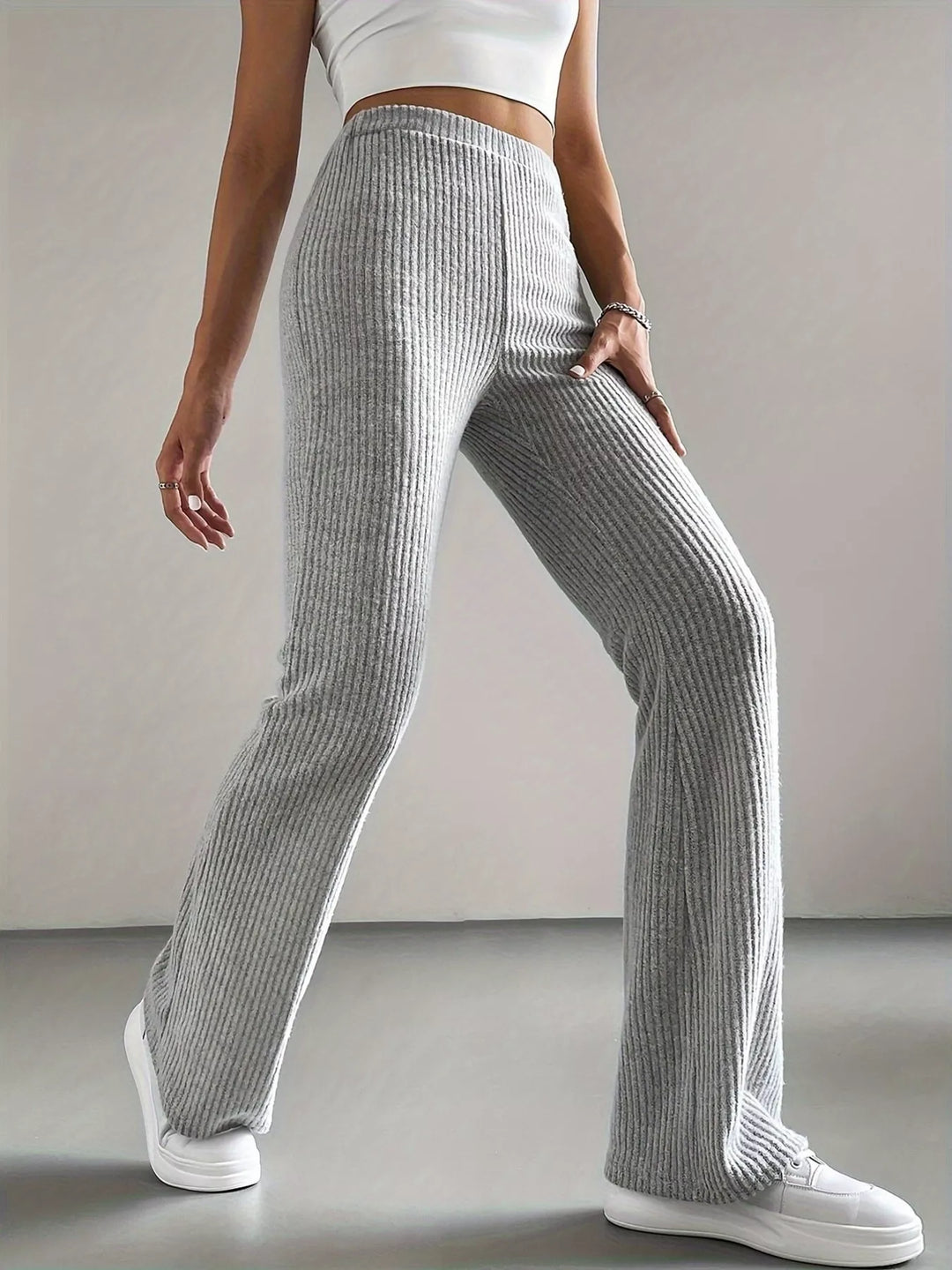 Heather gray flare pants side view in a mid stride pose