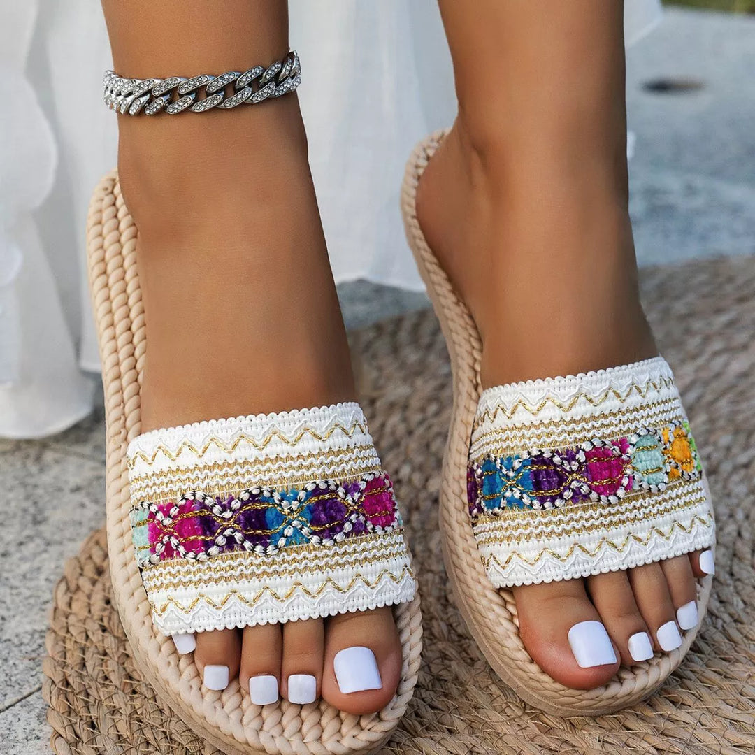 White multi flat slide sandals with colorful embroidered woven band