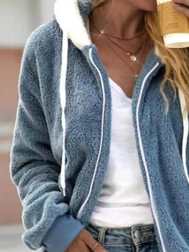 Dusty blue fuzzy hooded fleece jacket styled with a white tee and jeans