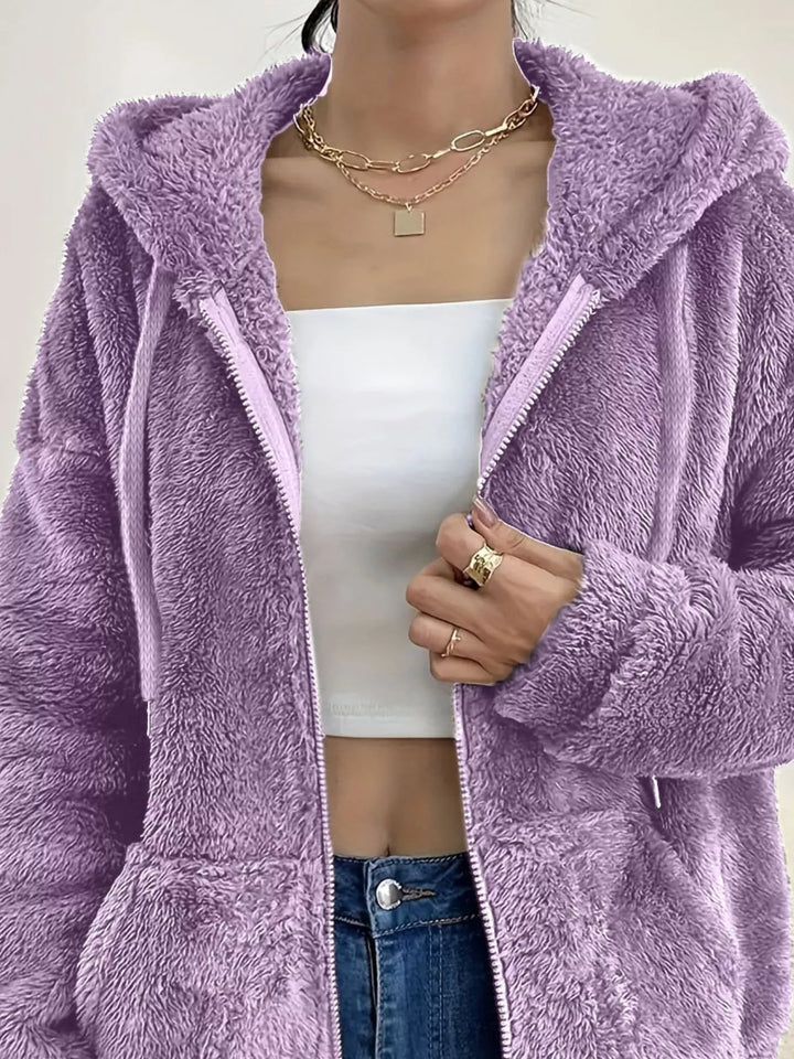 Close-up of lilac fleece jacket open zip front and hood drawstring