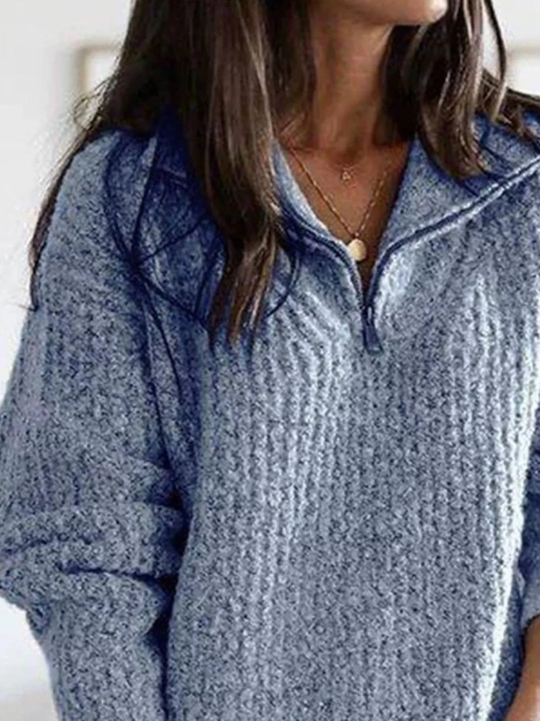 Dusty blue half zip ribbed knit sweater, close view of the collar and zipper
