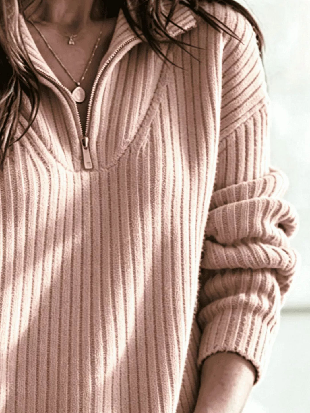 Dusty pink half zip ribbed sweater, close view of the collar and zipper