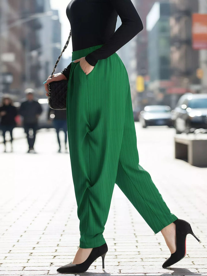 Emerald tapered ankle harem pants seen walking in black heels