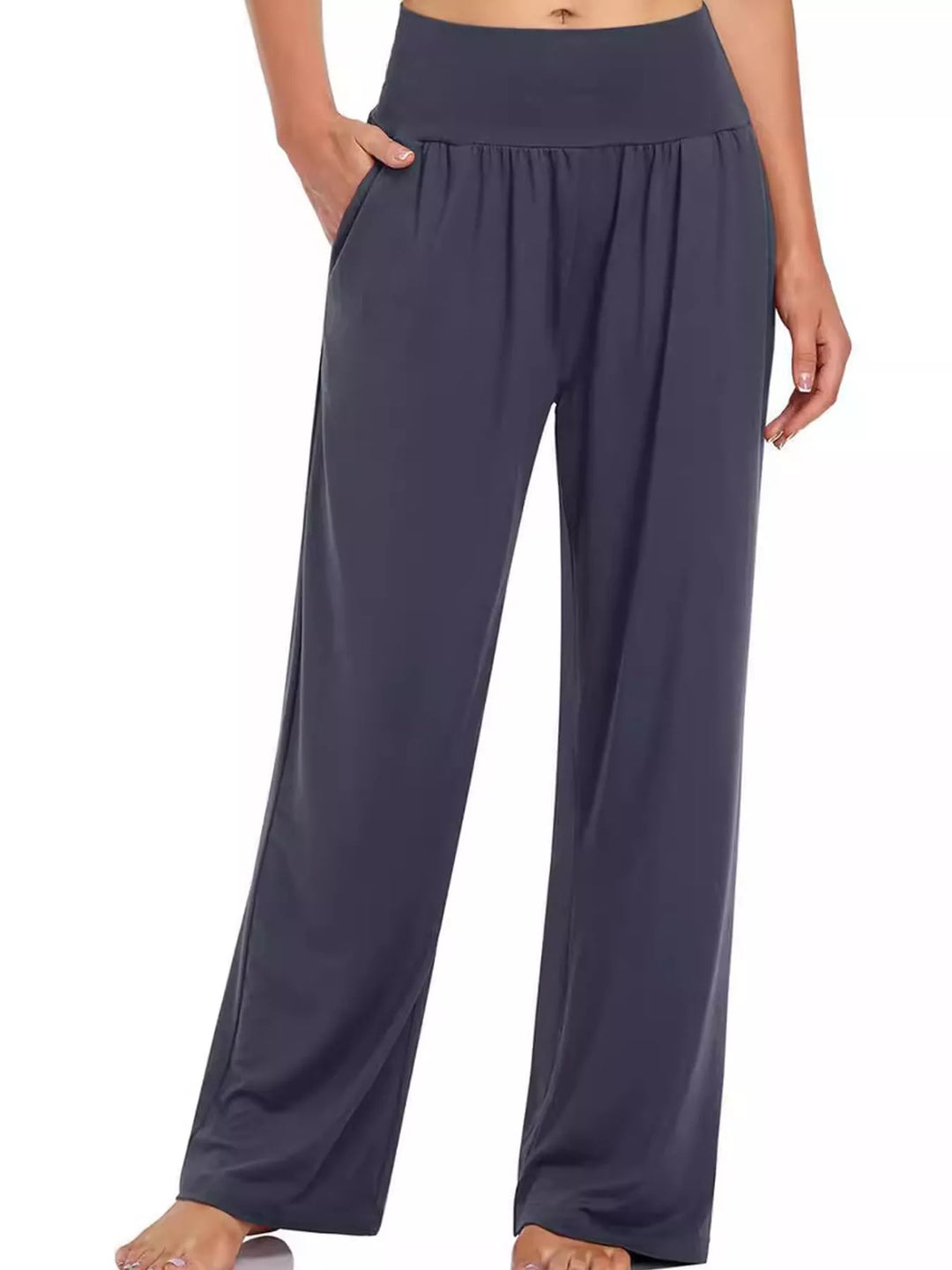 Charcoal high waisted wide leg pants, front view with hand resting at the pocket