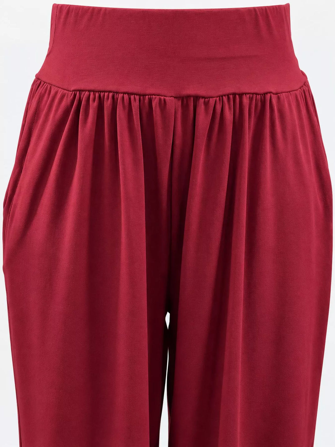 Crimson high waisted wide leg pants, close-up of the waistband and pocket