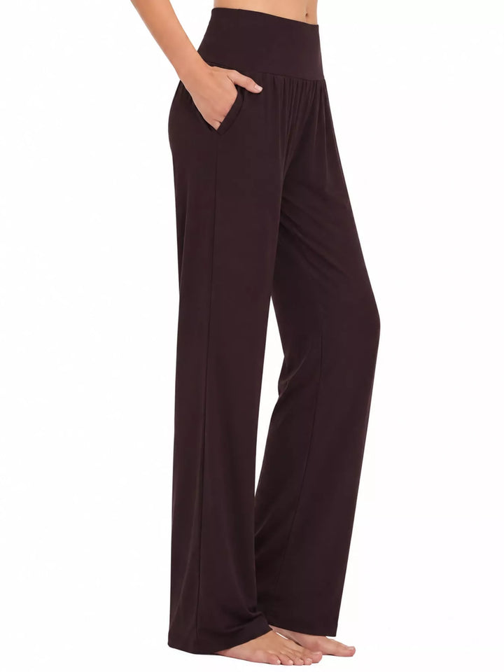 Dark brown high waisted wide leg pants, side view with pocket and flowing leg