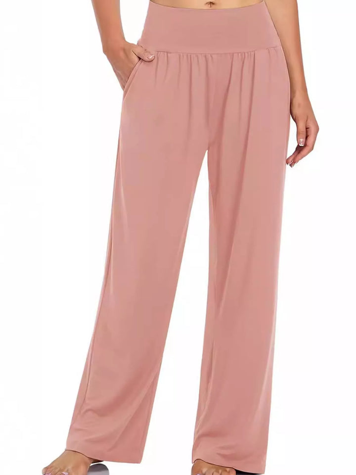 Dusty rose high waisted wide leg pants, front view with hand in pocket