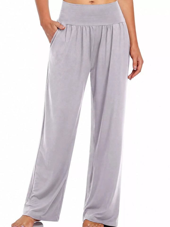 Light gray high waisted wide leg pants, front view with hand in pocket