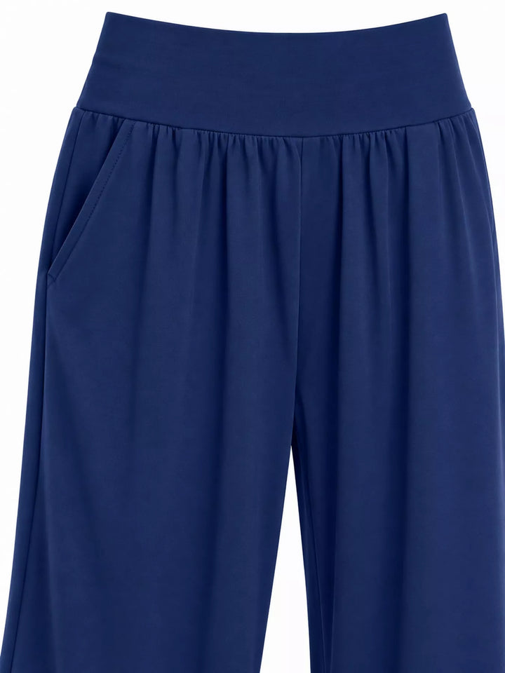 Royal blue high waisted wide leg pants, close-up of the smocked waistband and pocket