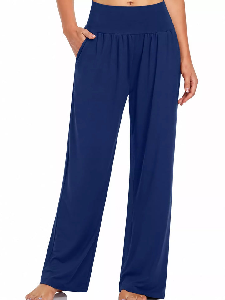Royal blue high waisted wide leg pants, front view with hand in pocket