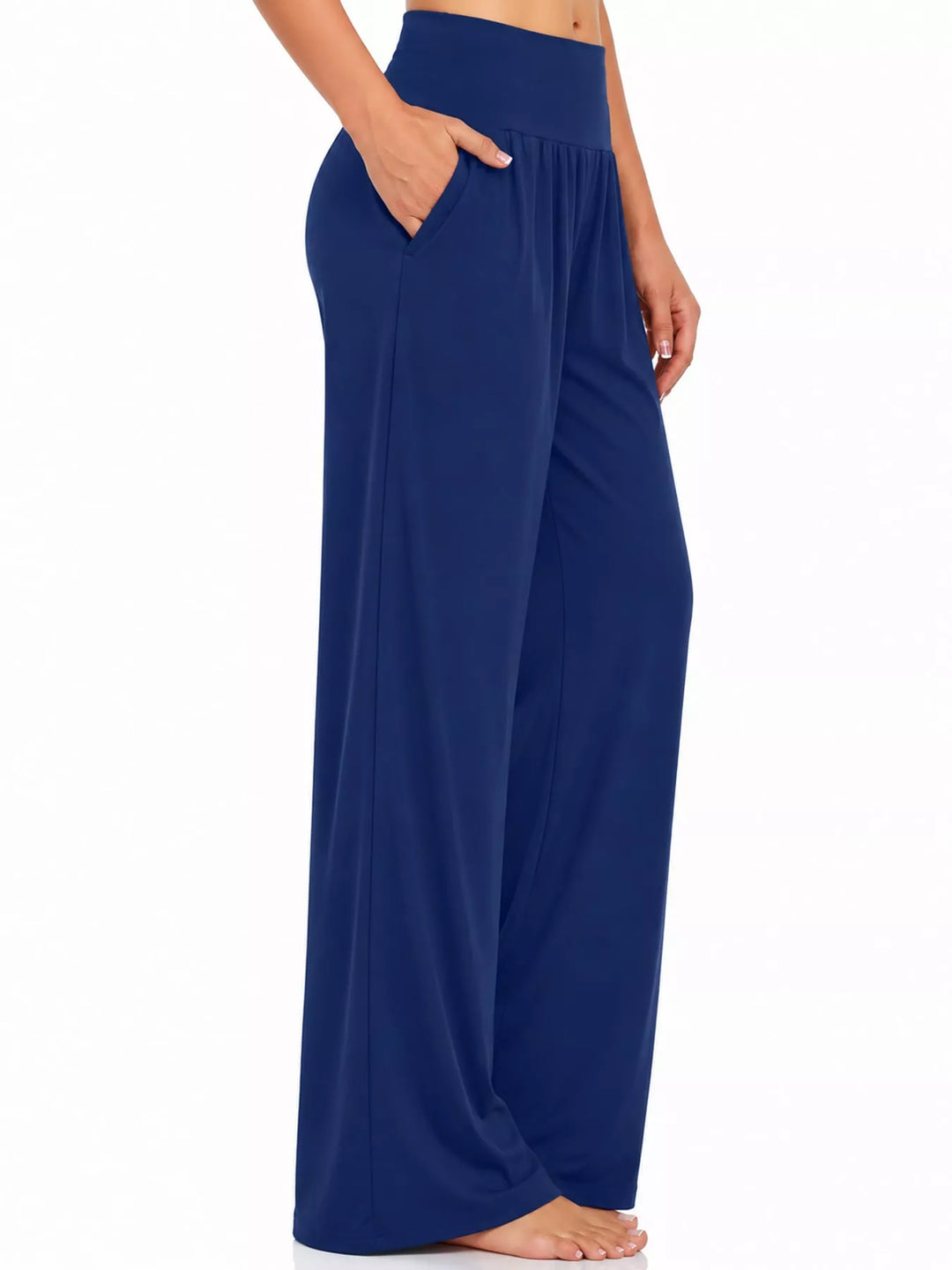 Royal blue high waisted wide leg pants, side view with pocket and bare feet