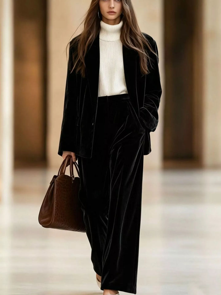 Black velvet-look blazer and wide leg pants holiday outfit with a white turtleneck