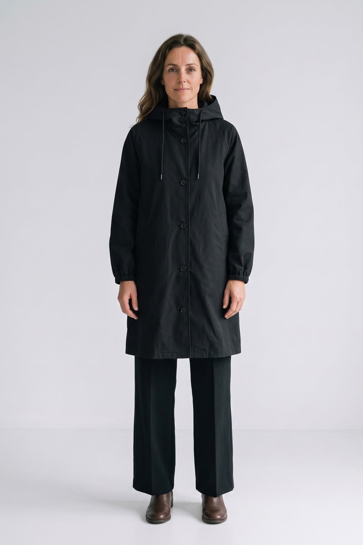 Women's Hooded Raincoat | Button-Front — Black — front view — on model