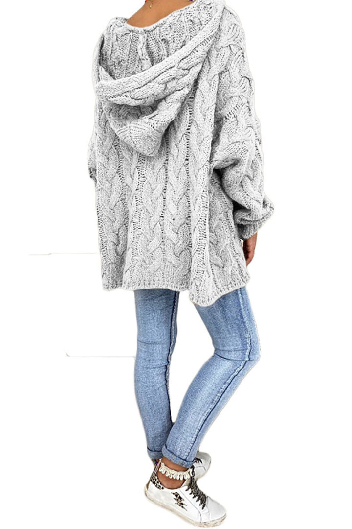 Light gray oversized hooded sweater side view with jeans and white sneakers