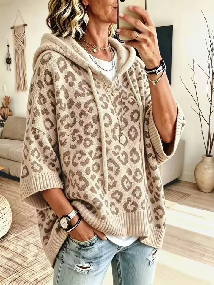 Beige oversized hooded sweater with leopard jacquard and drawstring, front view