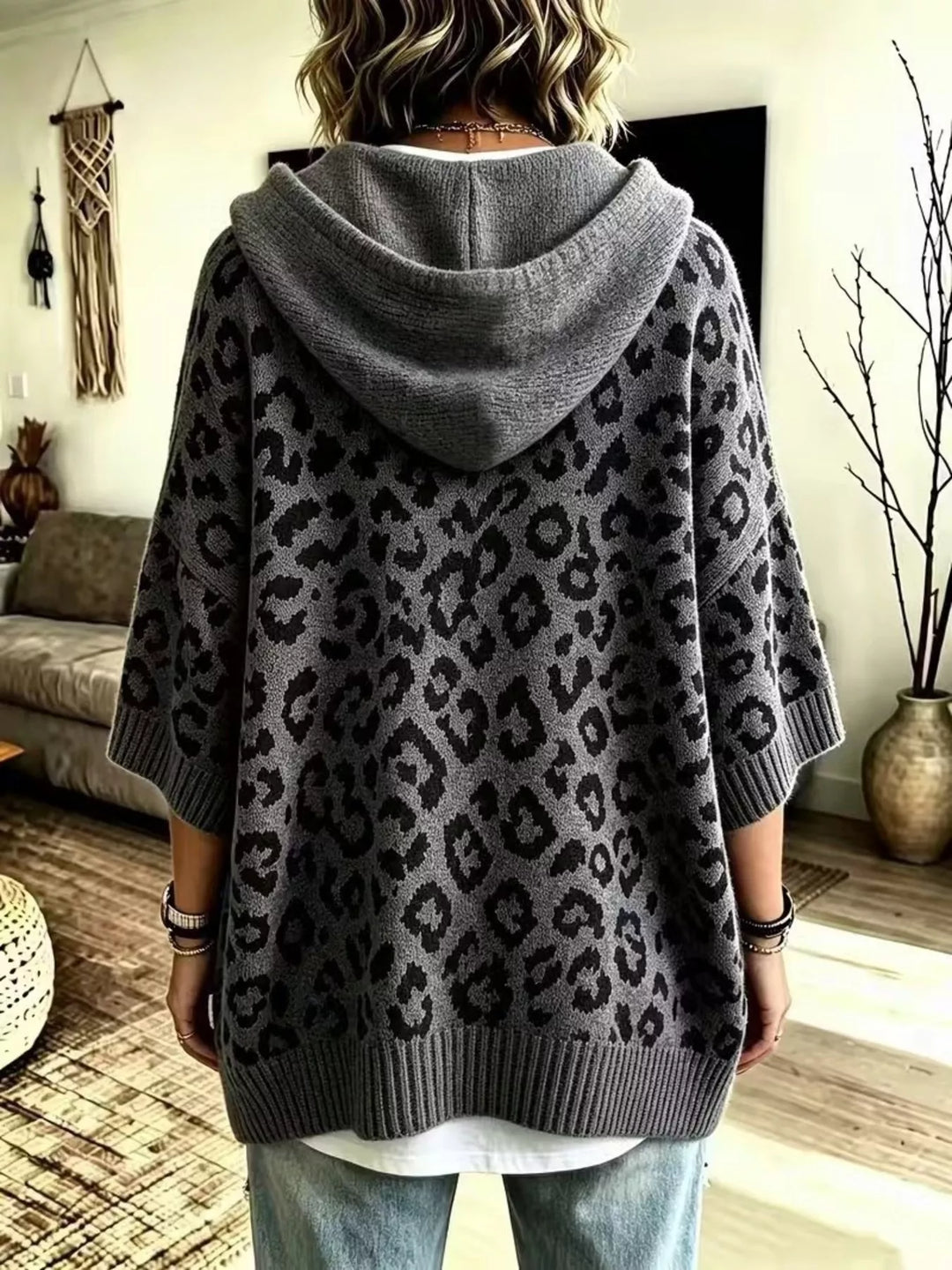 Back view of the dark gray oversized leopard hooded sweater