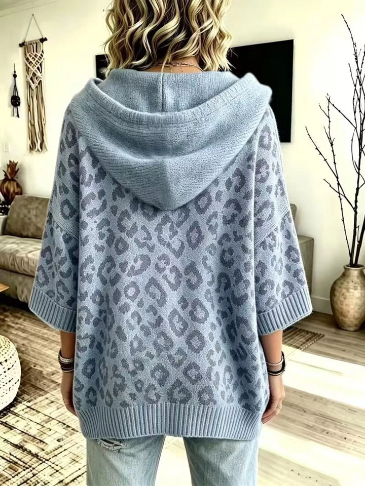 Back view of the dusty blue oversized hooded sweater with leopard pattern