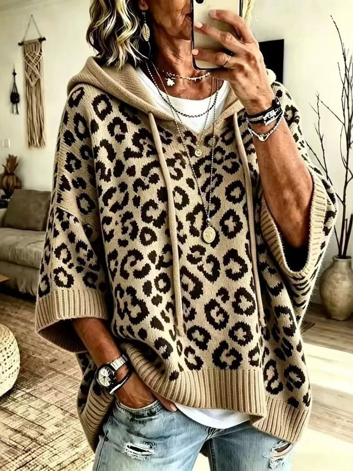 Khaki leopard jacquard hooded sweater worn with light jeans and a white tee