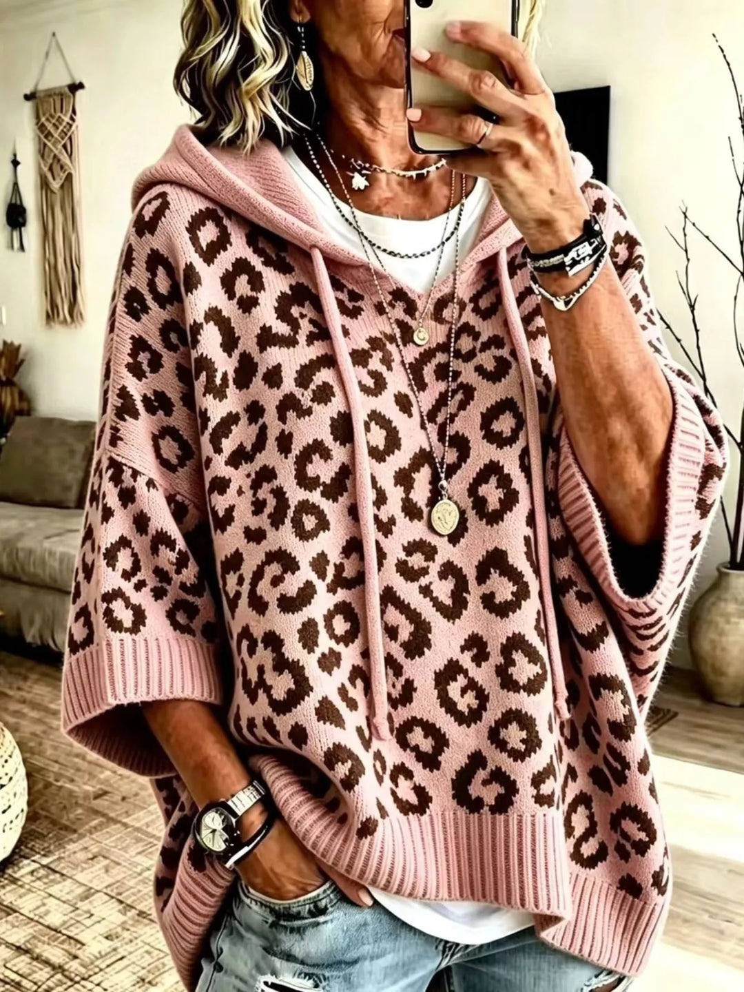 Rose leopard hooded sweater worn with jeans and layered necklaces