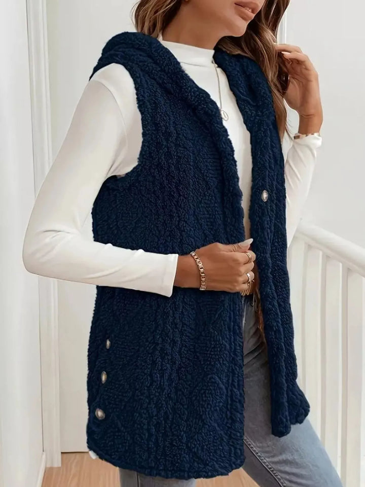 Side view of the navy fluffy vest with side button detail