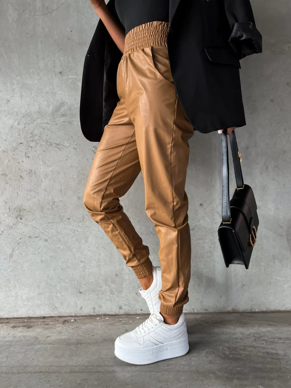 Camel high rise tapered jogger pants with white platform sneakers