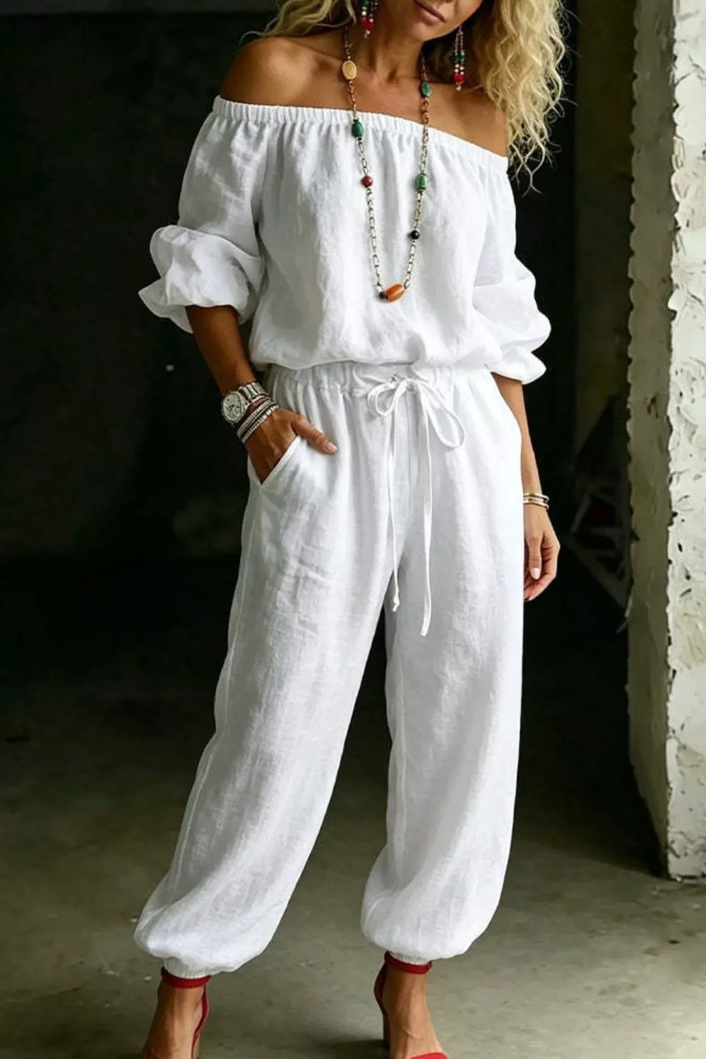 Women's jogger set in white with an off shoulder puff sleeve top and pants