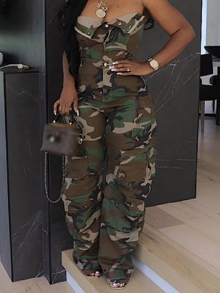Green camo cargo jumpsuit with hand on hip and a small handbag