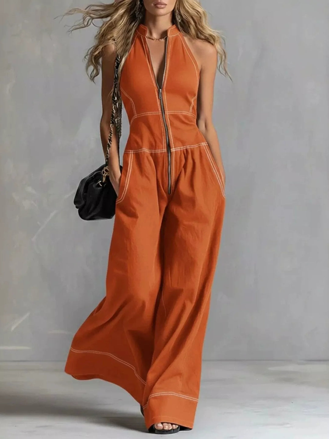 Burnt orange halter neck wide leg jumpsuit, full-length front view
