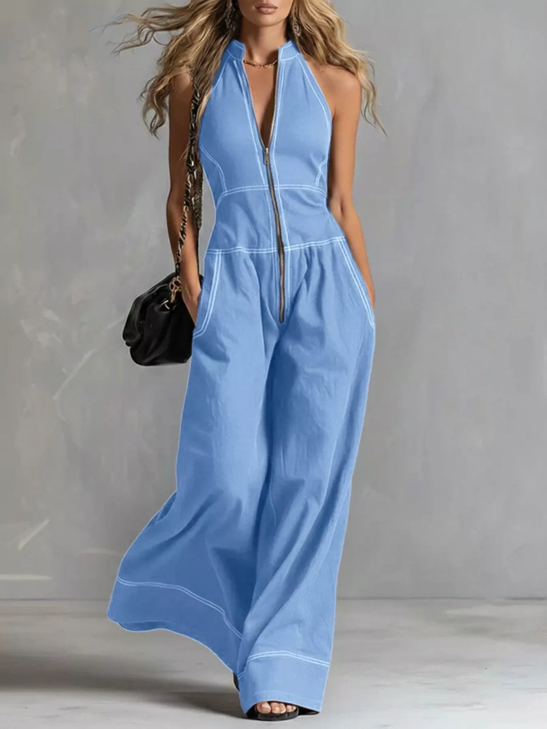 Sky blue halter neck wide leg jumpsuit with zip front, full-length view
